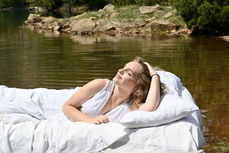 Woman lying in a lake