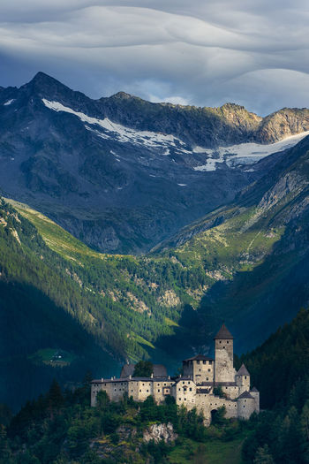 Scenic view of mountains against sky and castle