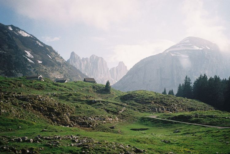 Scenic view of mountains against sky in the swiss alps in early summer. shot on 35mm film. 
