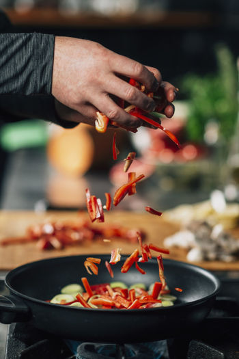 Close-up of chef preparing food in kitchen