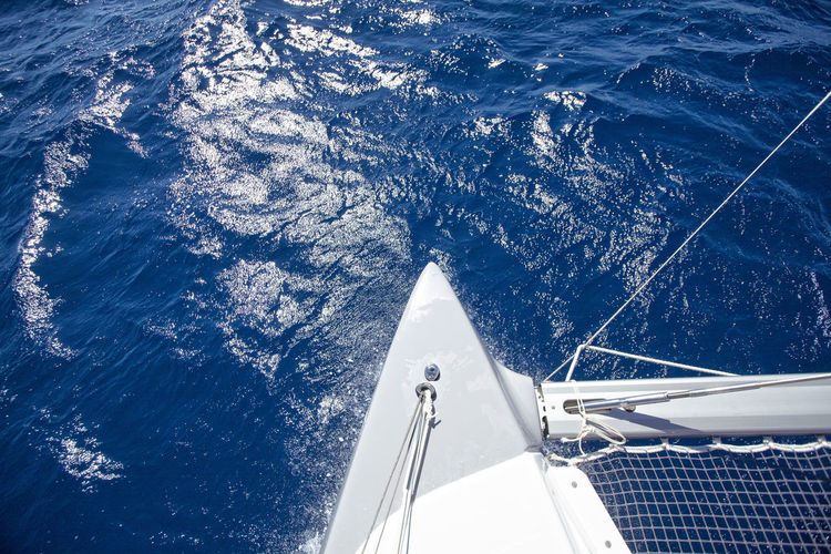 Bow of a catamaran during a cruise in the mediterranean sea.
