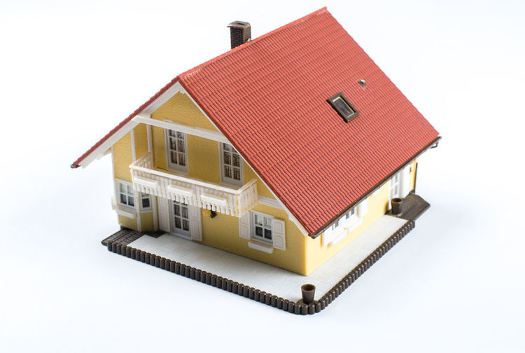Model house in front of a white background