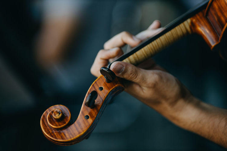 Close up hand holding violin