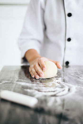 Close-up of chef preparing food