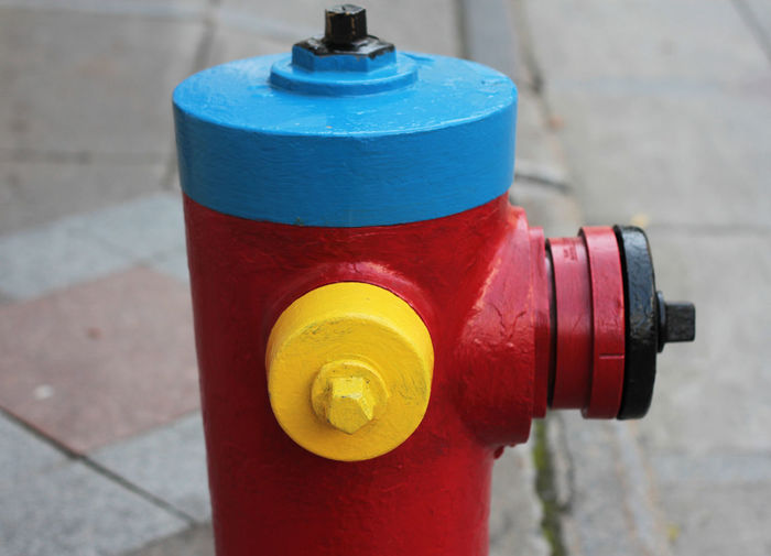 Close-up of fire hydrant on footpath