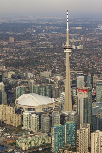 The cn tower and rogers centre during a sunny day