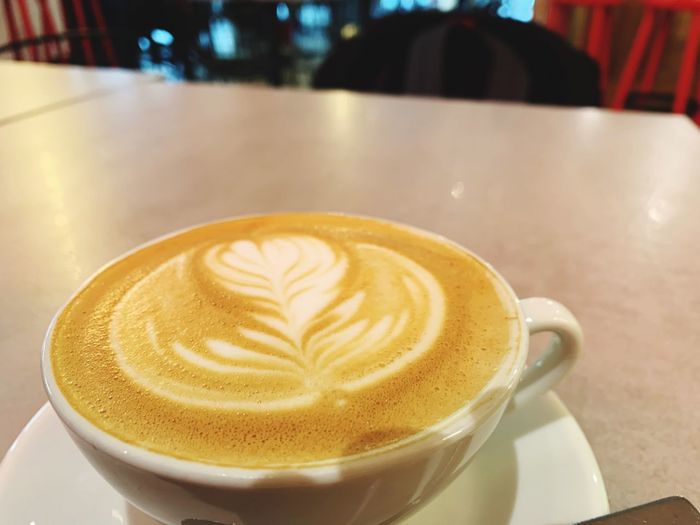 Close-up of cappuccino on table