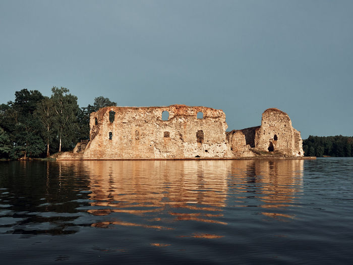 View to the koknese castle during the evening from perses river. latvia.