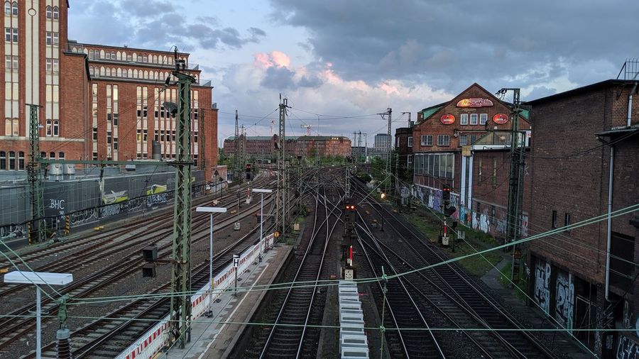 High angle view of railroad tracks amidst buildings in city