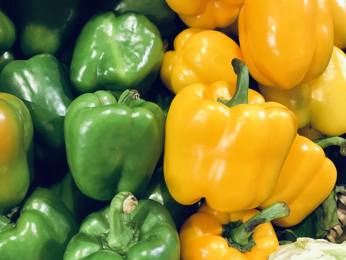 Green capsicum and yellow capsicu. full frame shot of bell peppers.