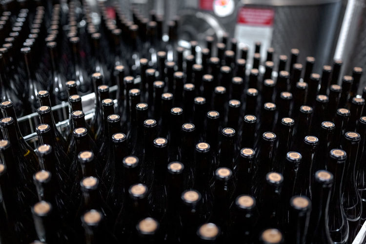 Wine bottles at winery production top view
