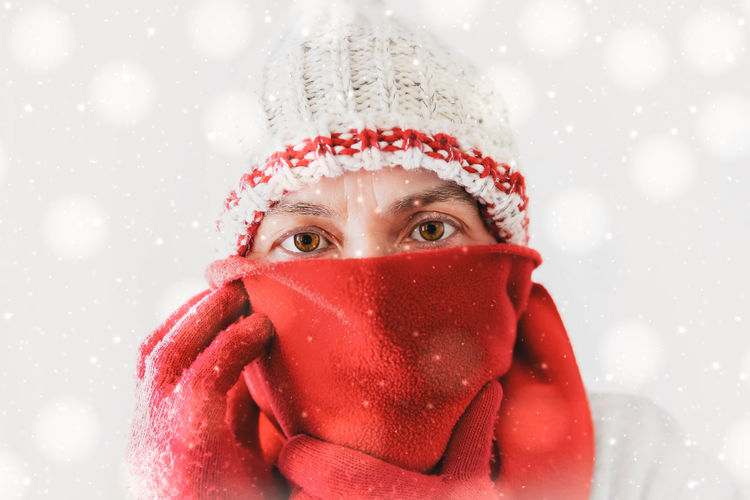 Close-up portrait of woman in winter