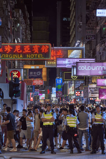 Crowd on city street at night
