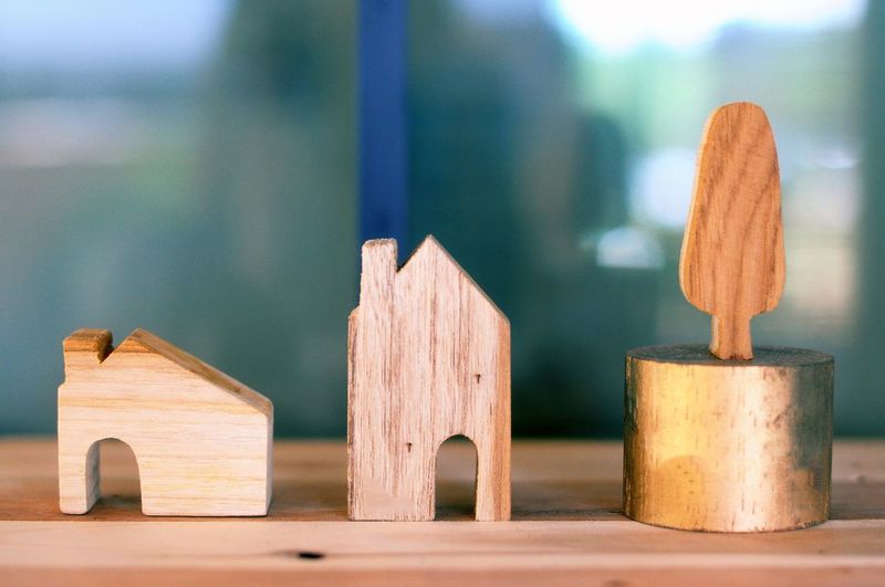 Close-up of wooden model houses on table