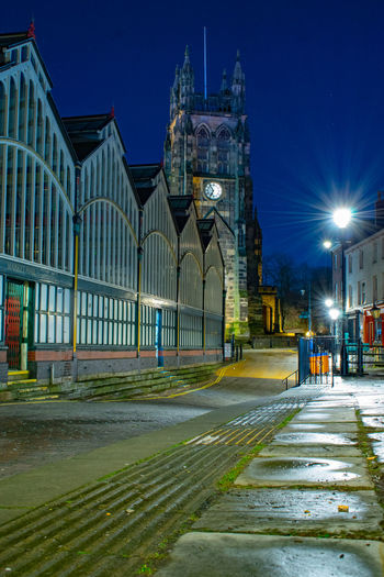 View of buildings in city at night