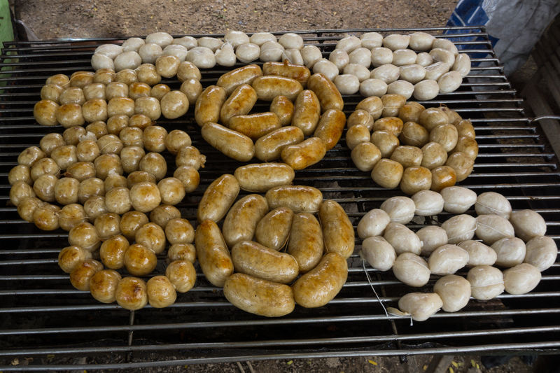 High angle view of meat roasting on barbecue grill