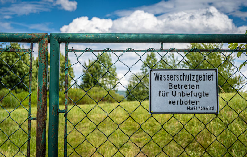 Warning sign on fence