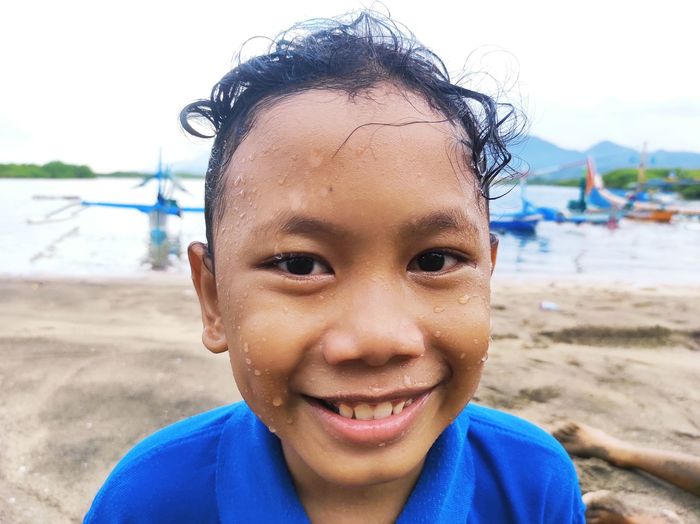 Portrait of smiling boy at beach