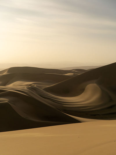 Scenic view of desert against sky during sunset in huacachina