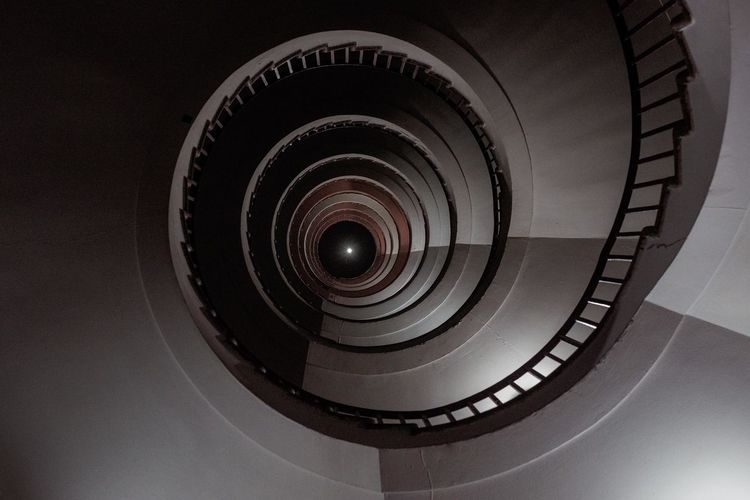 Low angle view of spiral staircase in building