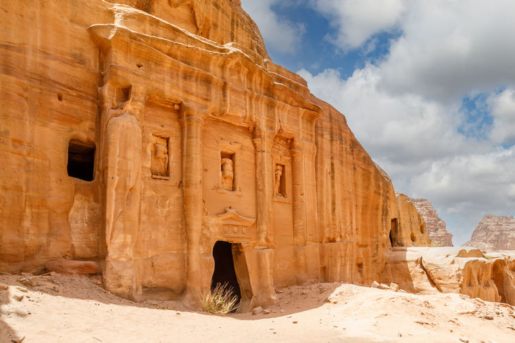 Ancient tomb of roman soldier and funeral ballroom carved in sandstone rock, petra, jordan