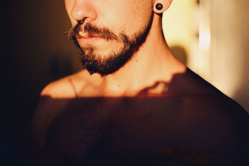Midsection of shirtless man