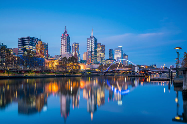Reflection of illuminated buildings in water