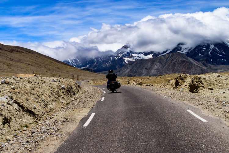 Biker going to explore gurudongmar lake, north sikkim, indo-china border