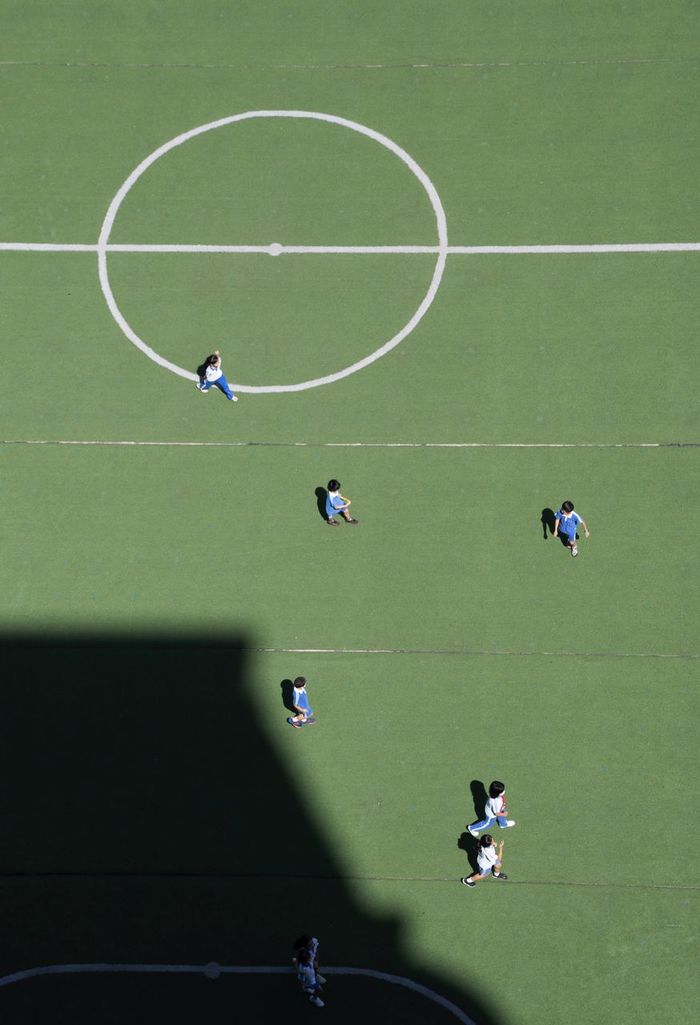 High angle view of people playing soccer on field