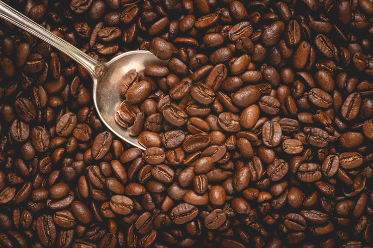 Coffee beans with silver spoon