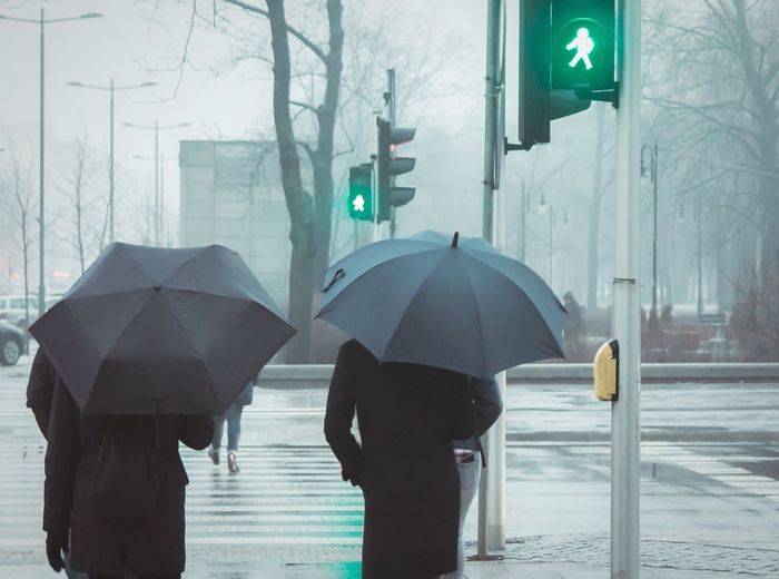 People walking in wet rain