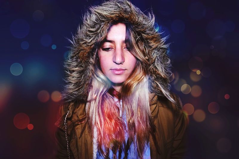 Portrait of young woman in winter coat