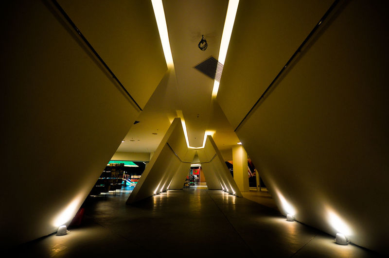 Low angle view of illuminated tunnel