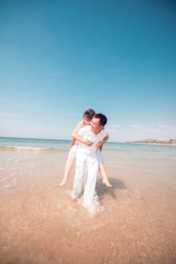 Couple standing on beach
