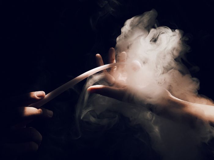 Hands with smoke