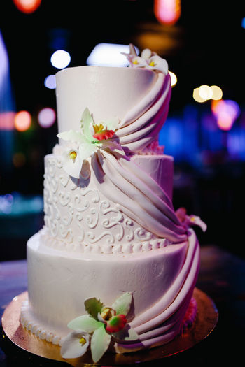 Close-up of cake against white roses