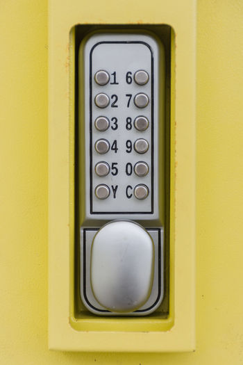 Close-up of telephone booth on wall