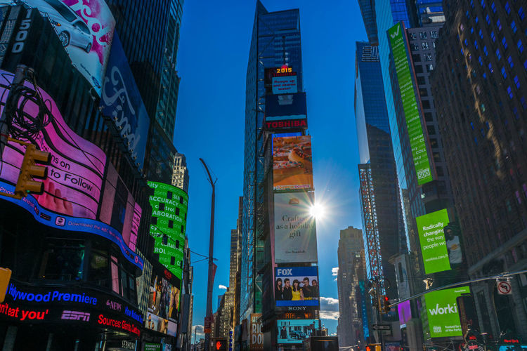 Low angle view of illuminated billboards on buildings at times square