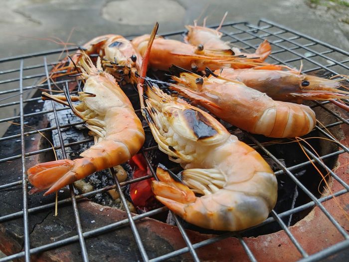 Close-up of seafood roasting on barbecue grill