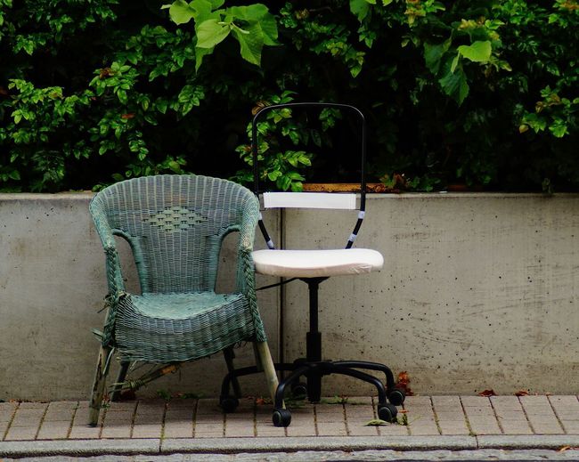 Empty chair on table in yard