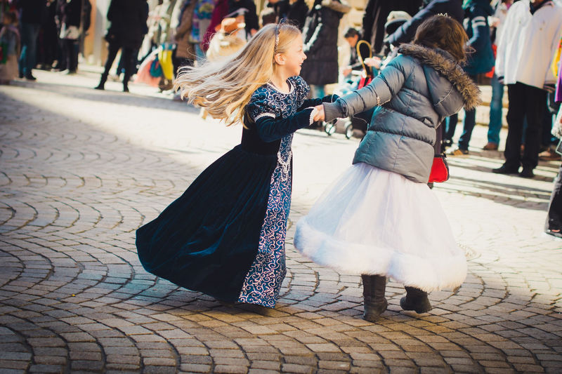 Girls in costume on city street