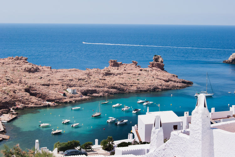 High angle view of sailboats by sea against sky
