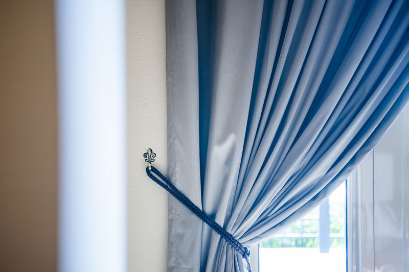 Curtain by window at home