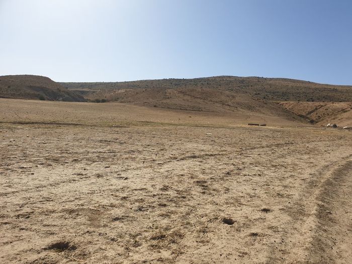 Scenic view of desert against clear sky