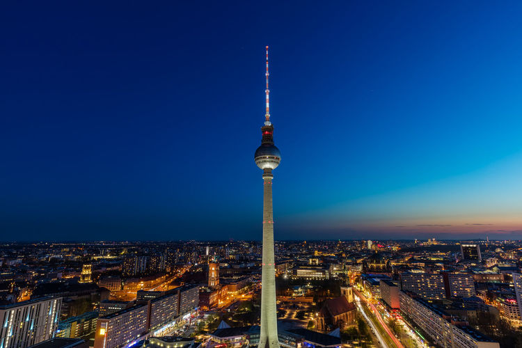 Berlin tv tower at sunset against blue sky