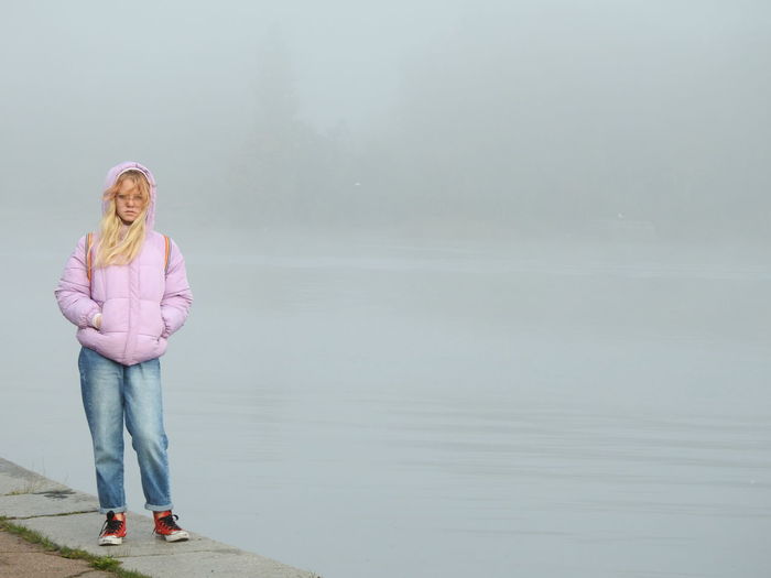 Portrait of girl standing in lake