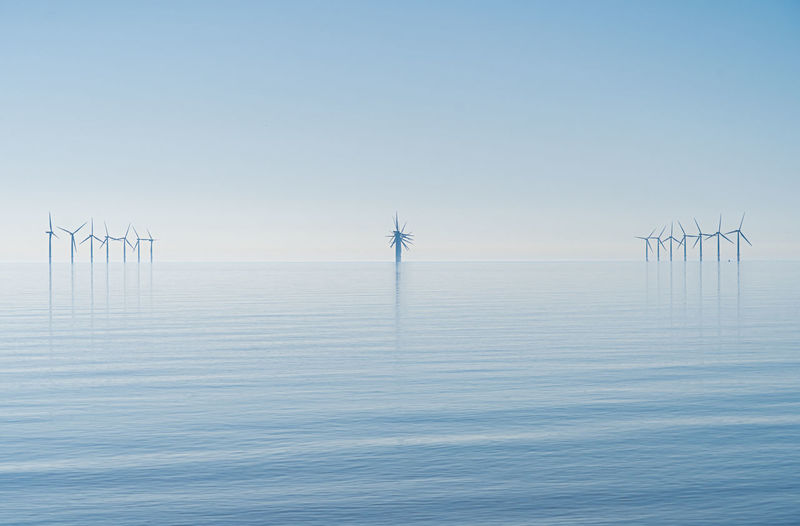 Offshore wind turbines generating renewable electricity and energy 