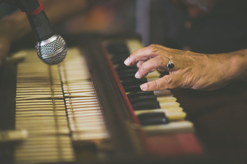 Cropped image of person playing guitar