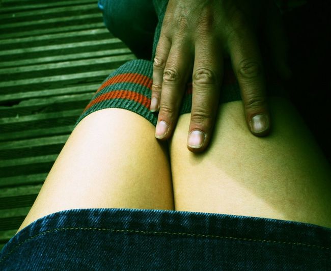 Low section of woman wearing shoes