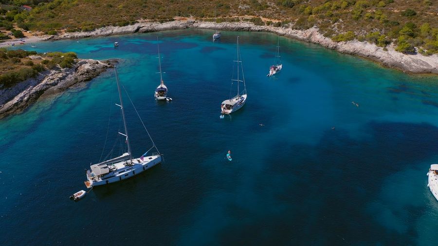 Anchoring yachts in bay. aerial drone view